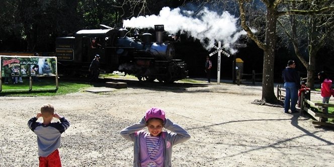 CLICK to continue: Sofia holding her ears while the steam train goes past